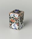 Fig. 24: De Metaale Pot, Tea canister made of faience painted with multi-coloured enamel, Delft, c.1695-1720, 9,3 × 5,8 × 5,8 cm (h,w,d), Rijksmuseum, Amsterdam, inv.nr. BK-NM-11524.  http://hdl.handle.net/10934/RM0001.COLLECT.16039