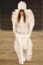 Fig. 4. A Native American headdress used as an accessory during Chanel’s “Metiers d’Art” Show - Tony Gutierrez/AP