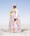 Herero Woman in Flowered Dress - Hereros - [Jim Naughten](https://jimnaughten.com/hereros)