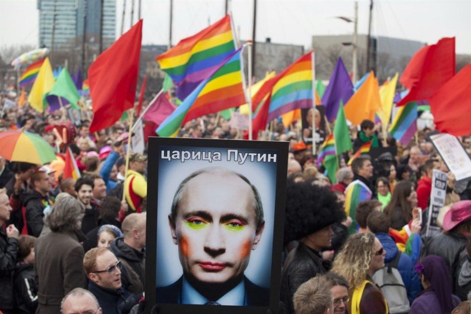 [A demonstrator holds up a picture depicting Russian President Vladimir Putin](https://www.nbcnews.com/feature/nbc-out/russian-voters-back-referendum-banning-same-sex-marriage-n1232802)