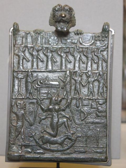 Probably the most elaborate “amulet” to ward off Lamashtu (AO 22205 from the Louvre, time ca. 1000-500 BCE). The third row shows a sick person on a bed, stretching out an arm, the person is flanked by exorcists dressed in fish robes. In the lowest row we find Lamashtu kneeling on a donkey in a boat. To the left of her is Pazuzu driving her away. The same Pazuzu looks at us from the top of the object. Credits: wikimedia commons, Tangopaso, [Wikimedia](https://commons.wikimedia.org/wiki/File:Plaque_de_conjuration_contre_la_Lamashtu_(Louvre,_AO_22205)_avec_annotations.jpg) (with Step 4)