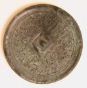 Bronze mirror with a pattern that starts with four leaf-like forms protruding from the central square against a background - Eastern Zhou dynasty, 5th-4th century BCE - Smithsonian - S2012.9.2475.jpg