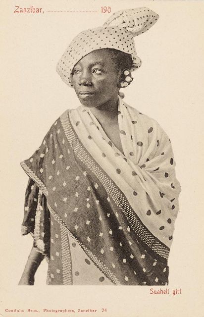 Fig 8: Young Swahili woman wearing a dotted wrapping cloth and head wrap - Coutinho Brothers, Zanzibar 1900 - [On Afrosartorialism](https://afrosartorialism.wordpress.com/2015/04/25/the-kanga-modernity-conspicuous-consumption-and-cultural-translation-in-colonial-zanzibari-fashion/)