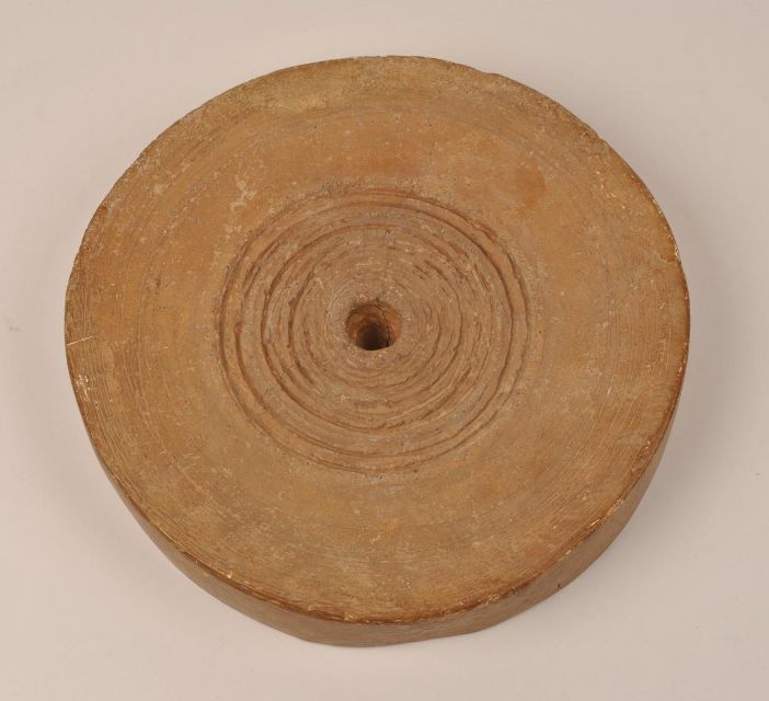Figure 1: A Minoan potter’s wheel from 1700-1450 BCE - Trustees of the British Museum - [1905,0613.1](https://www.britishmuseum.org/collection/object/G_1905-0613-1)
