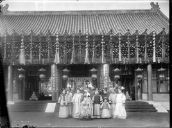 Cixi fixing her hair ornaments during a  picture together with her attendants - Smithsonian Institution
