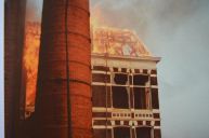 Flames burning on the roof of the old factory building - Photo taken from the Bastiaan family archive