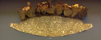 Fig. 1. Diadem of the infant - National Archaeological Museum of Athens - [Wikimedia](https://upload.wikimedia.org/wikipedia/commons/5/5c/NAMA_Gold_diadem_with_repouss%C3%A9_rosettes_and_an_infant%2C_consisting_of_pieces_of_gold_foil-_Grave_Circle_A.JPG) 