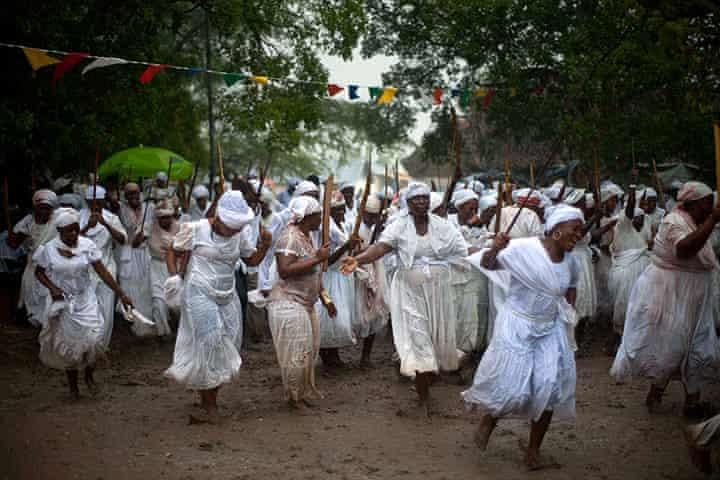 Voodoo believers dancing during a religious ceremony - Ramon Espinosa - “Holy Week in Haiti and Dominican Republic - in pictures,” [The Guardian](https://www.theguardian.com/world/gallery/2012/apr/10/haiti-religion#/?picture=388530012&index=14) 