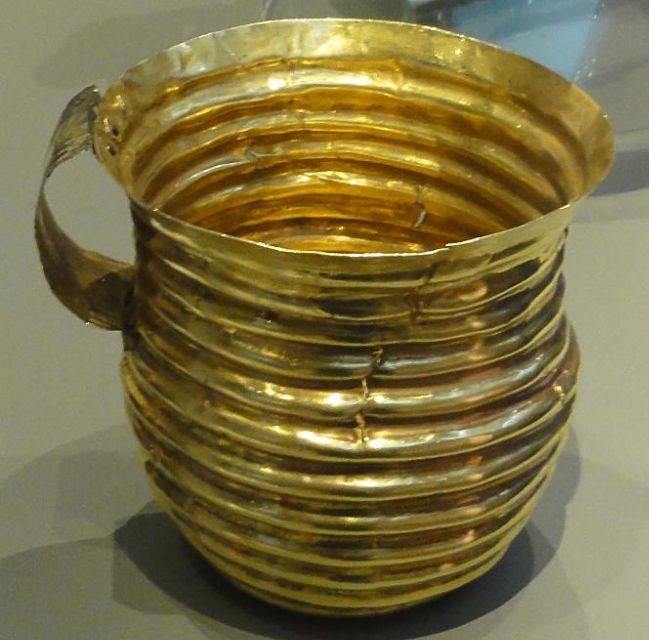 Fig 9: The so-called Rillaton Cup, found in Rillaton Barrow (Krug Reslegh) shows a resemblance to contemporary objects from the Aegean. It has been used as an example for interaction between the tin mining region of Cornwall and the bronze producing centres in the Aegean - [Wikimedia](https://commons.wikimedia.org/wiki/File:Rillaton_Cup.jpg) 