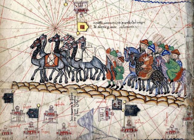 Fig. 1. Marco Polo’s Caravan transporting goods via camel across the silk road, image from the _Catalan Atlas_ (1375) - [Wikimedia](https://commons.wikimedia.org/wiki/File:Caravane_Marco_Polo.jpg)