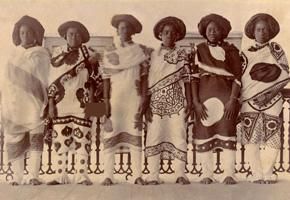 Fig. 6. Swahili servants in Zanzibar wearing kangas - Compliments of Zanzibar National Archive - [AV 31.32] (https://www.astate.edu/a/museum/exhibits/wearing-what-cannot-be-spoken/index.dot)
