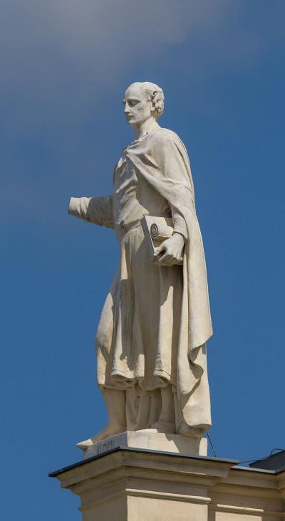 Alcuin of York - [Wikipedia](https://en.wikipedia.org/wiki/Alcuin#/media/File:AT_13763_Roof_figures_at_the_Kunsthistorisches_Museum,_Vienna-8.jpg)
